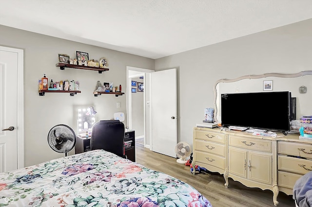 bedroom with light hardwood / wood-style floors