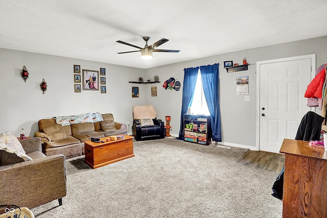 carpeted living room with ceiling fan