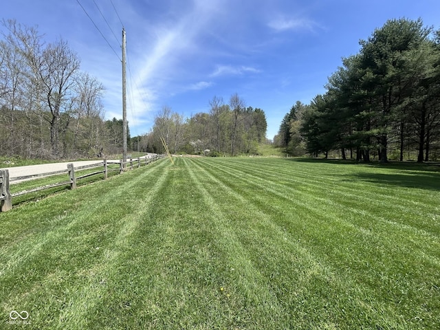 9695 S Houston Rd, Freetown, IN 47235 - view of yard featuring fence and a rural view