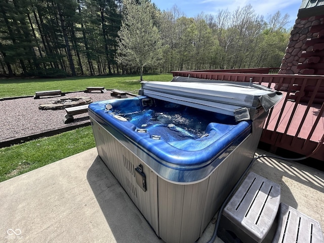 9695 S Houston Rd, Freetown, IN 47235 - view of patio featuring a hot tub, a deck, and a forest view