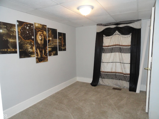 interior space featuring a paneled ceiling