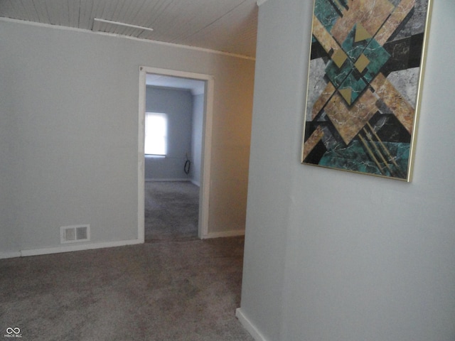 corridor with carpet flooring and ornamental molding