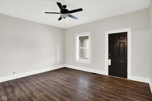 foyer entrance featuring ceiling fan and dark hardwood / wood-style flooring