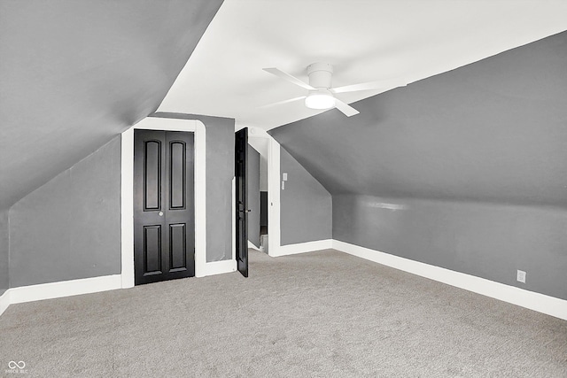 additional living space with ceiling fan, lofted ceiling, and carpet flooring