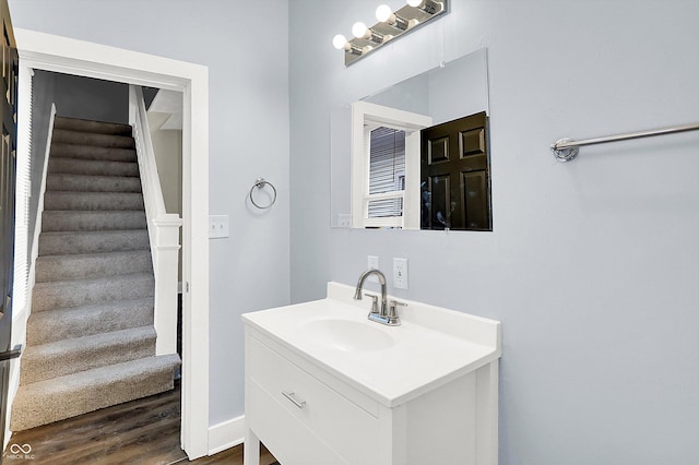 bathroom with vanity and wood-type flooring