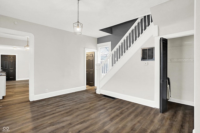 interior space with dark hardwood / wood-style flooring