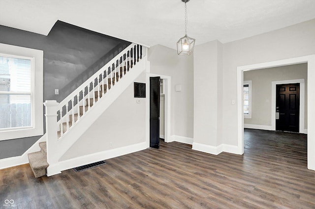 stairs with hardwood / wood-style flooring