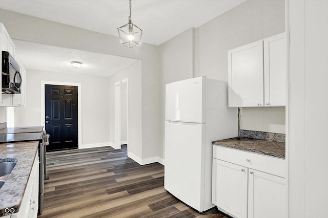 kitchen featuring pendant lighting, white cabinets, white fridge, electric range, and dark wood-type flooring