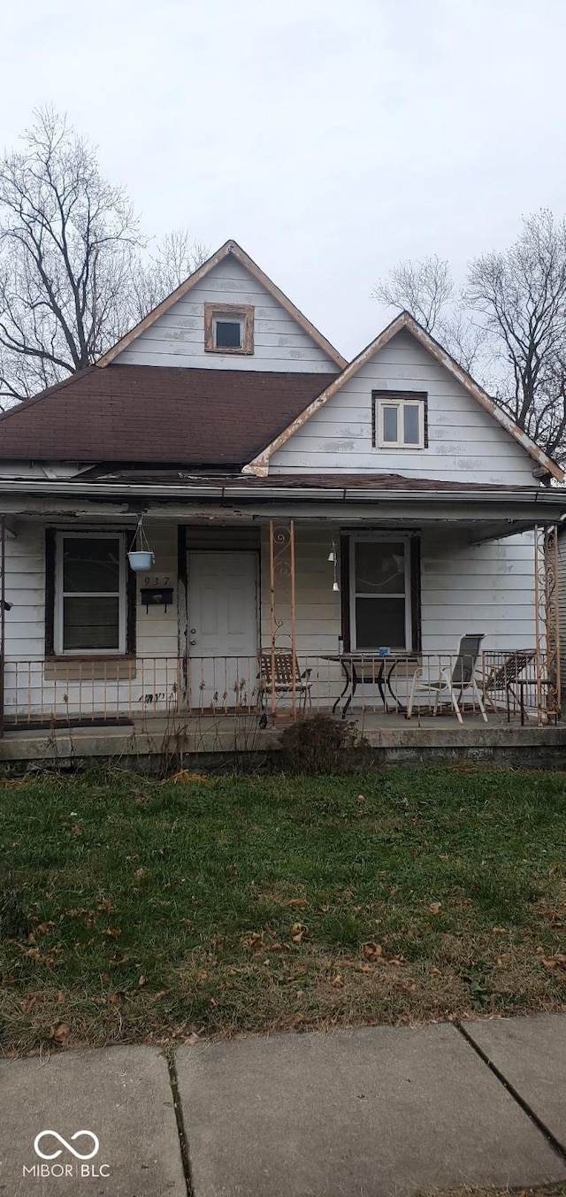 view of front of house with a front lawn and a porch