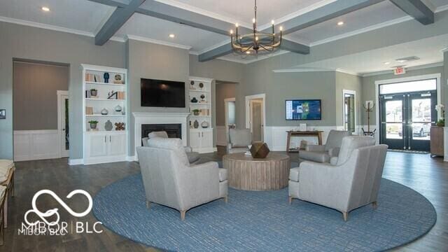 living room with dark hardwood / wood-style flooring, french doors, beamed ceiling, and a chandelier