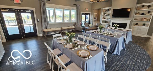 dining room with dark hardwood / wood-style flooring, a chandelier, and french doors