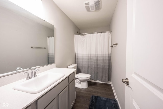 bathroom featuring hardwood / wood-style flooring, vanity, toilet, and a shower with shower curtain