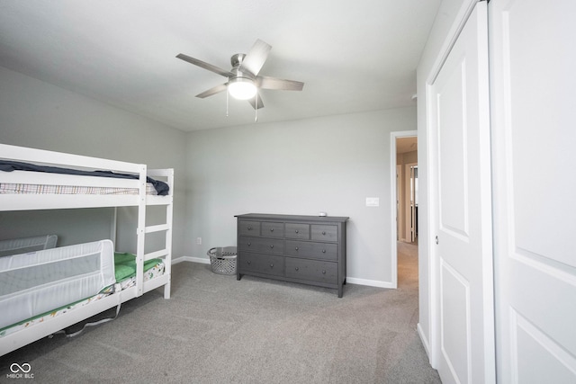 bedroom featuring light carpet and ceiling fan