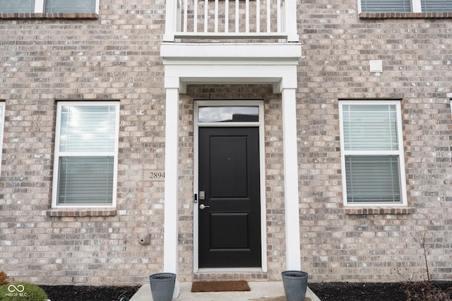 property entrance with a balcony