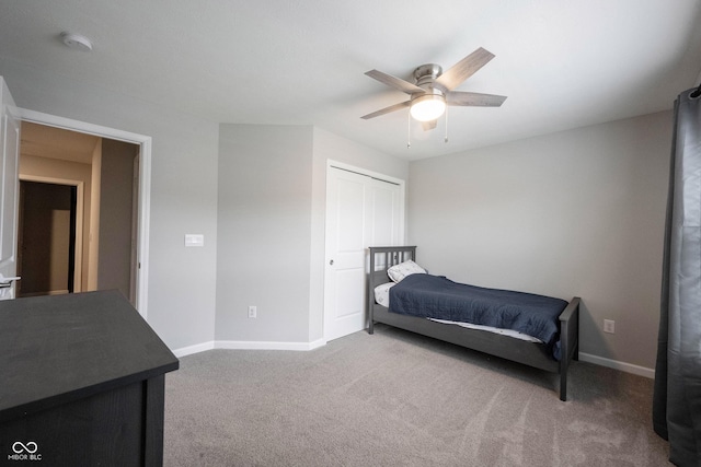 bedroom featuring carpet floors, a closet, and ceiling fan