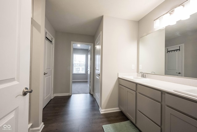 bathroom featuring hardwood / wood-style floors and vanity