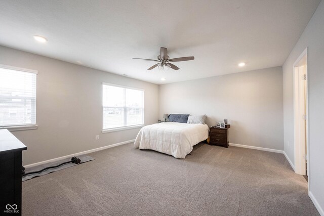 bedroom with ceiling fan and carpet floors