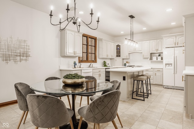 dining space with recessed lighting, baseboards, and light tile patterned floors