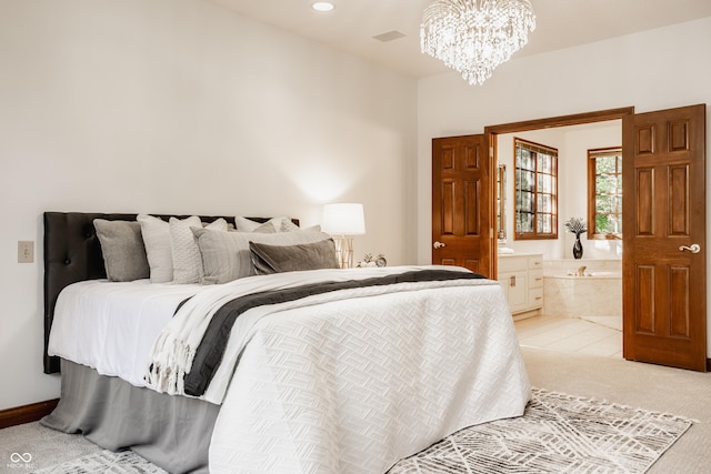 bedroom with visible vents, ensuite bath, an inviting chandelier, recessed lighting, and light colored carpet