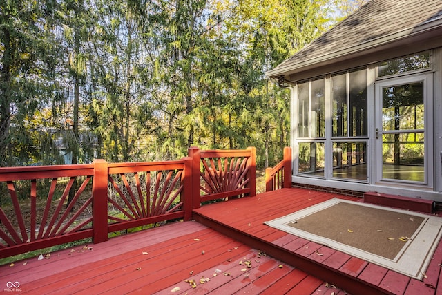 wooden terrace featuring a sunroom