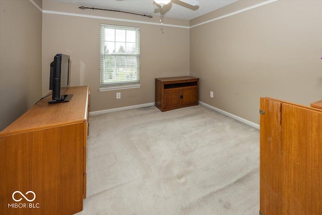 interior space with light colored carpet and ceiling fan