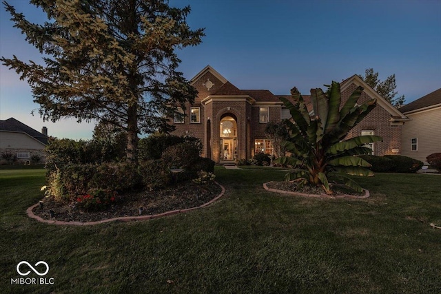 view of front of home with a lawn