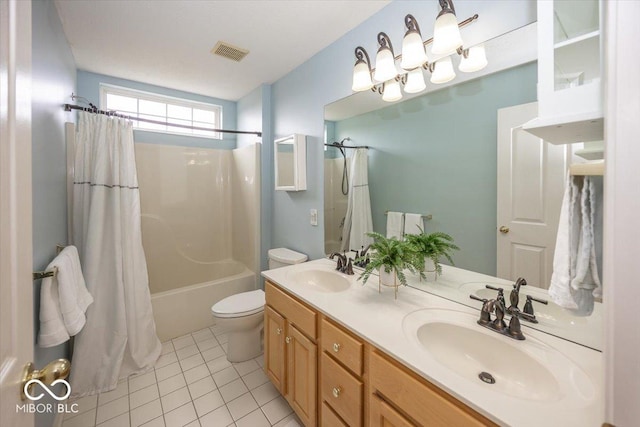 full bathroom featuring vanity, toilet, tile patterned floors, and shower / bath combo with shower curtain