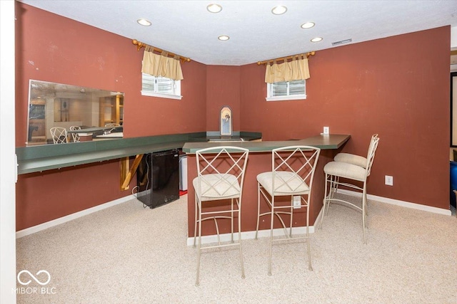 view of carpeted dining space