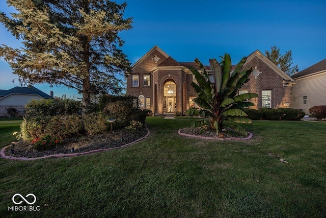 view of front of home with a yard