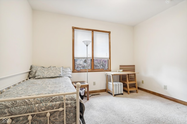 bedroom with carpet and radiator heating unit