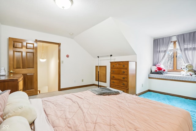 bedroom featuring carpet floors and vaulted ceiling