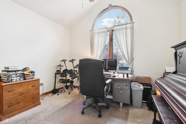 carpeted office featuring ceiling fan, a healthy amount of sunlight, and lofted ceiling