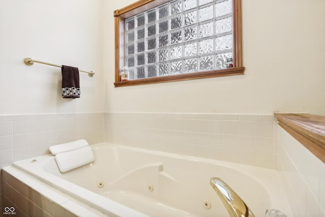 bathroom featuring tiled bath