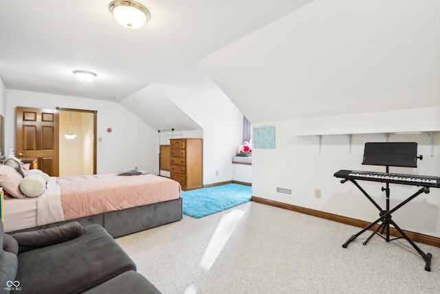 bedroom featuring lofted ceiling