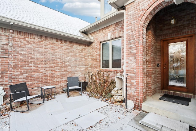 view of snow covered property entrance