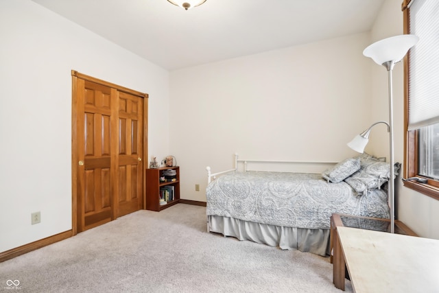 bedroom with carpet and multiple windows