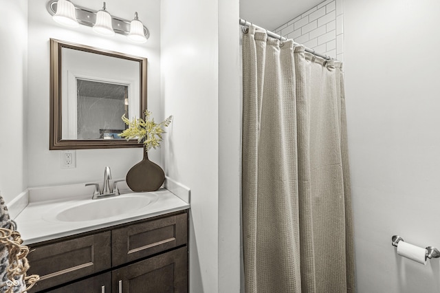 bathroom with a shower with curtain and vanity