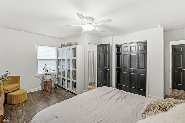 bedroom featuring a closet, ceiling fan, and dark hardwood / wood-style floors