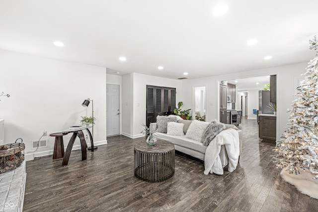 living room with dark hardwood / wood-style floors