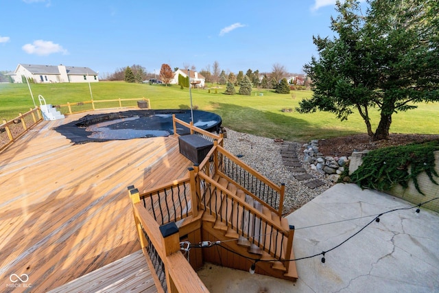 exterior space with a yard and a wooden deck