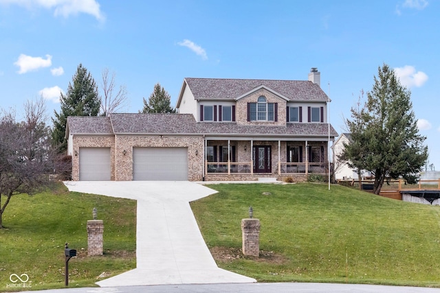 view of front of home with a porch, a garage, and a front yard