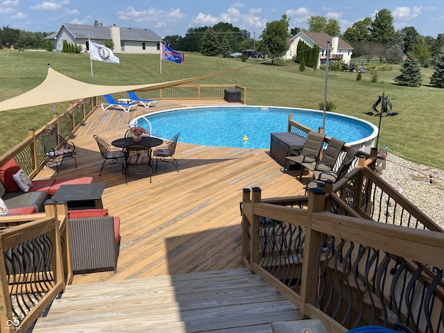 view of pool featuring a wooden deck