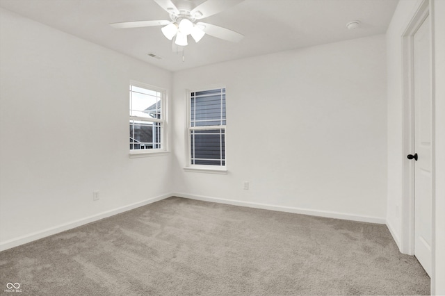 carpeted empty room with ceiling fan