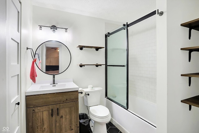 full bathroom featuring tile patterned floors, vanity, a textured ceiling, enclosed tub / shower combo, and toilet