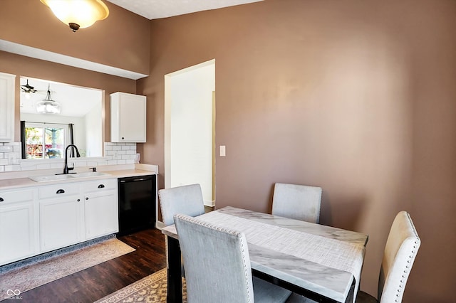 dining area featuring dark hardwood / wood-style flooring and sink