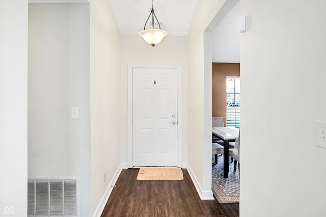 interior space with dark hardwood / wood-style flooring