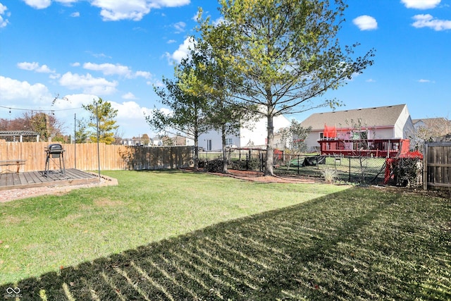 view of yard featuring a deck