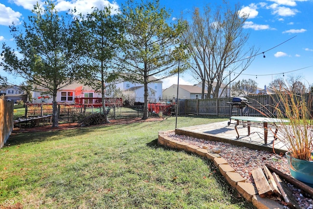 view of yard featuring a wooden deck