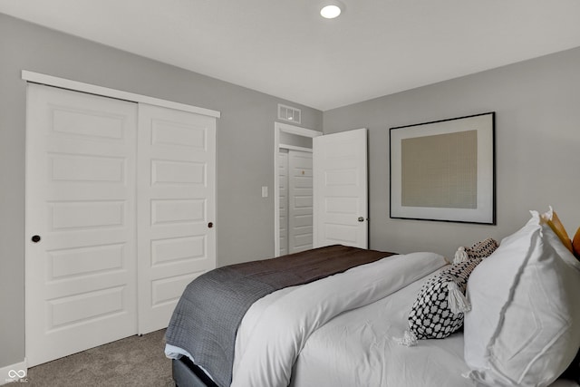 carpeted bedroom with a closet