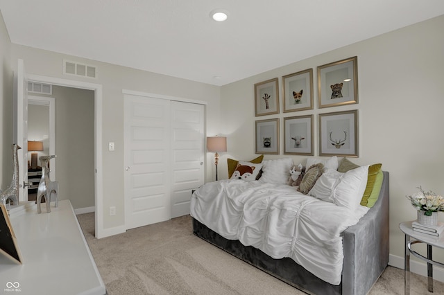 carpeted bedroom with a closet